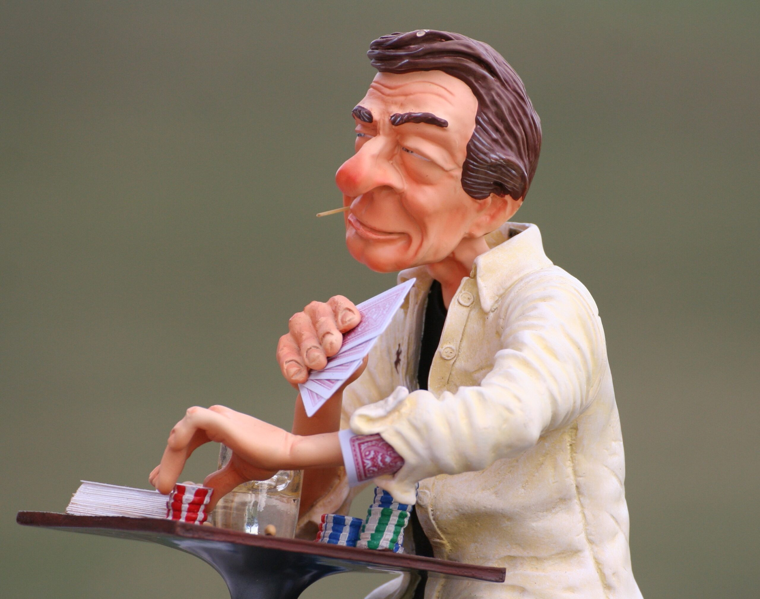 A poker player holding their nerve while bluffing at the table