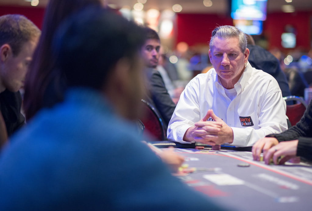 Mike Sexton smiling during a poker event