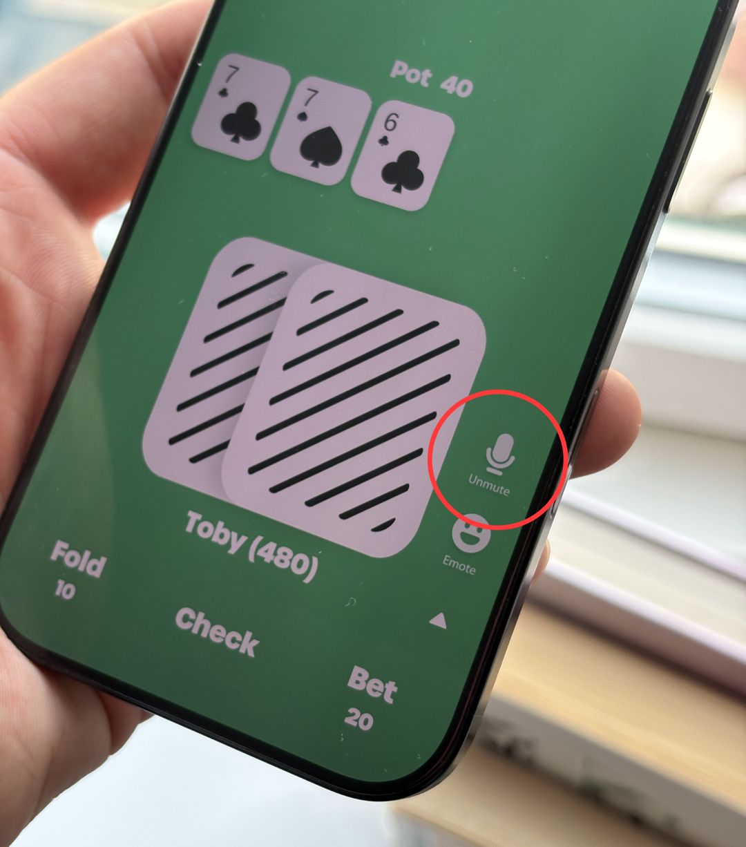 The Unmute button at an EasyPoker table, circled, which opens the microphone when tapped
