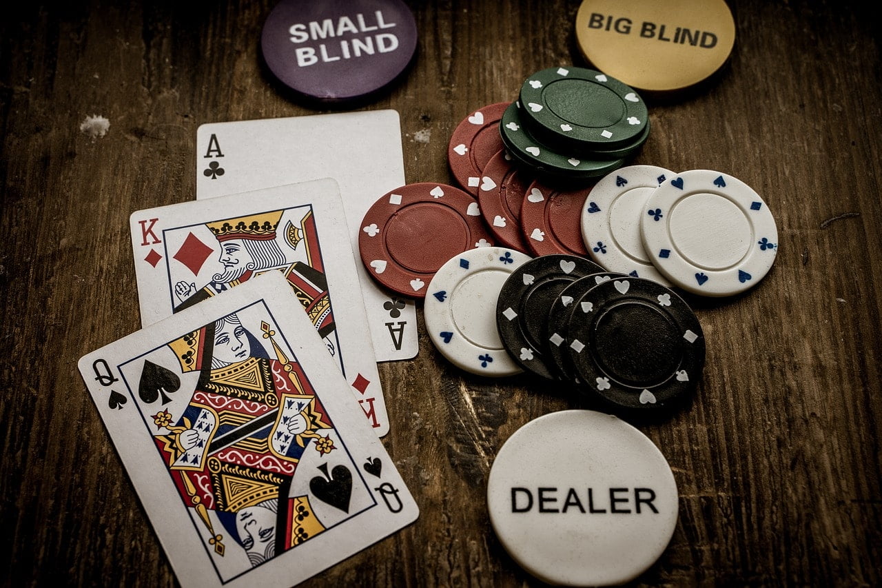 Playing cards and poker chips on a wooden table