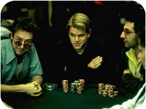 A dealer's hands mid-shuffle at a home poker game