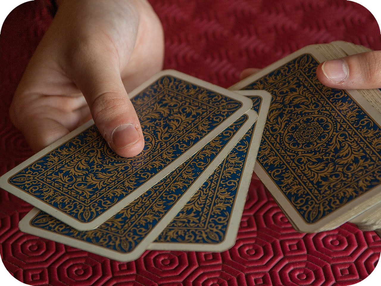 A deck of cards being examined for marks along the edges